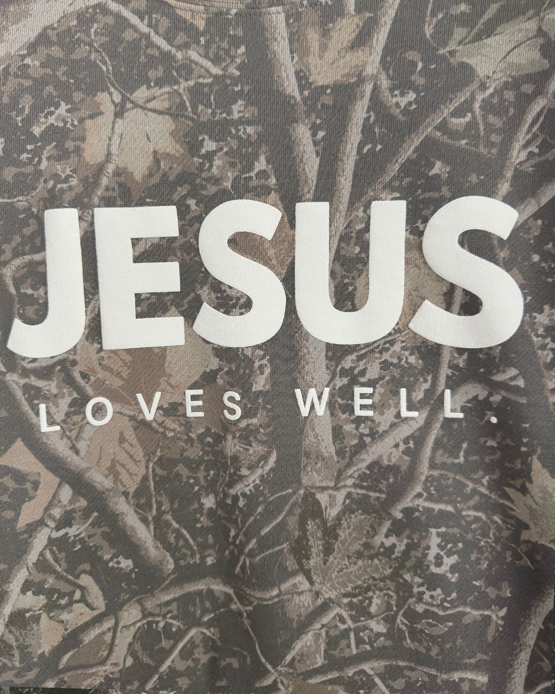 Love Well Jesus Loves Well Wordmark Crewneck in Deadwood Camo
