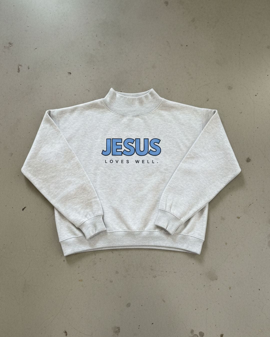 Love Well Jesus Loves Well Wordmark Mock Neck Sweatshirt in Gray/Blue
