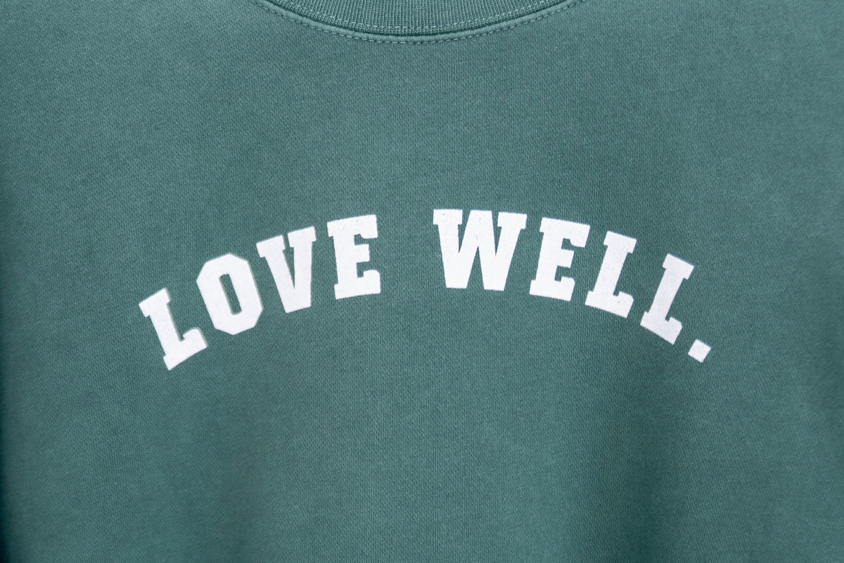 Love Well Vintage Ivy Crew Sweatshirt in Pine, front view, close-up detail